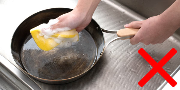 Using detergent will wash away the seasoned oil, making it more prone to rust.